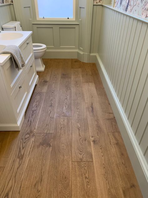 Engineered oak wood flooring in bathroom Oak Flooring Bathroom, Wooden Flooring In Bathroom, Bathroom Flooring Wood Look, Faux Wood Bathroom Floor, Cottage Bathroom Wooden Floor, Wooden Bathroom Flooring, Dark Wooden Floor Bathroom, Wooden Bedroom Flooring, Wooden Floors In Bathroom