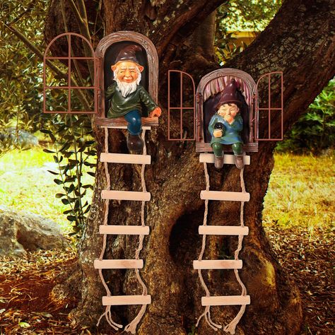 PRICES MAY VARY. Adorable figurines: there are 2 styles elf out the door tree hugger, one is the elf out the door tree hugger smiling with 5.7 x 5.9 x 1.5 inches, the other one is the elf sitting on the window tittering with 7 x 5.9 x 1.9 inches, and 2 pieces ladder hanging tree decorations, size is 2.55 x 13.77 inch, cute and vivid statues will add much fun to your garden decor Add interesting to your garden: you can hang these cute garden statue gnomes on your tree or fence that appear to be c Hanging Tree Decorations, Door Tree, Tree Statues, Garden Gnomes Statue, Fairy House Diy, Fairy Garden Crafts, Tree Faces, Lawn Ornament, Fairy Tree