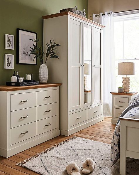 Part of the Julipa Brand. Bring an elegant country-style charm into your bedroom with the Ashford bedroom range. This package includes the 2 x 2 Drawer Bedside, 6 Drawer Chest and the 3 Door Wardrobe. Featuring oak-effect tops which is perfectly contrasted by the wood-effect frame and a chunky plinth, this range is perfect to add a warm and homely feel to your bedroom. Doors feature classic panelling, drawers are sat on easy-glide runners that provide plenty of storage for all your bedroom essen Bedroom Furniture With Storage, Warm Bedroom Furniture, Freestanding Bedroom Furniture, Neutral Bedroom Wardrobe Ideas, Wardrobe And Chest Of Drawers Bedroom, Alvine Kvist Bedroom Ideas, Master Bedrooms With Wardrobes, Cream Wood Bedroom, White And Wood Bedroom Ideas