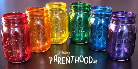 Rainbow-Tinted Mason Jars Tinted Mason Jars Diy, Seaglass Mason Jars Diy, Colour Glass Bottles Diy, Tinted Jars Diy, How To Tint Mason Jars, Rainbow Mason Jars, How To Color Wine Bottles, How To Make Colored Glass Jars, How To Color Mason Jars