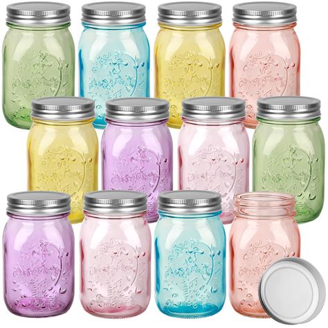 PRICES MAY VARY. Colorful Design: the mason 16 oz canning jars are designed in 6 different colors, and the colorful glass design will not fade easily; You can use color canning jars to store items or make DIY crafts What You Will Get: you will receive 12 pieces of 16 oz wide mouth canning jars with silver lids; Assorted colors of chromatic canning jars can meet your daily use and replacement needs, and you can also share them with friends as party gifts Quality Material: the regular month vintag Jar Of Notes, Jar Chandelier, Mason Jar Chandelier, Colored Mason Jars, Jars With Lids, Wide Mouth Mason Jars, Bath Ball, Canning Jar, Glass Storage Jars