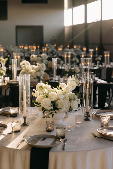 White Wedding Decorations Elegant, Wedding Decor Furniture, Elegant Minimalist Wedding Reception, Glass Compote Centerpiece, Classic Wedding Centerpieces Romantic, Elegant Wedding Set Up, Circle Table Wedding Set Up, Beige And Black Wedding Decor, Wedding Reception White Flowers