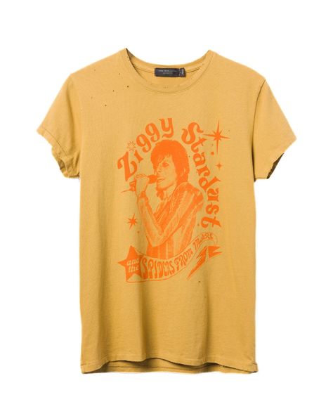 PRICES MAY VARY. 100% Cotton Imported Machine Wash Transform your look in our Women's David Bowie Ziggy Spiders From Mars Vintage Destroy Tee in Honey Gold with orange graphic. Our Vintage Destroy tee has all over destruction details to give it that completely worn-in, vintage feel that you love. *Distressing is unique for each tee and will vary Band Tees, Vintage Tees Women, Spiders From Mars, Orange Graphic, David Bowie Ziggy, Band Tee Shirts, Ladder Stitch, Food Clothes, Ziggy Stardust