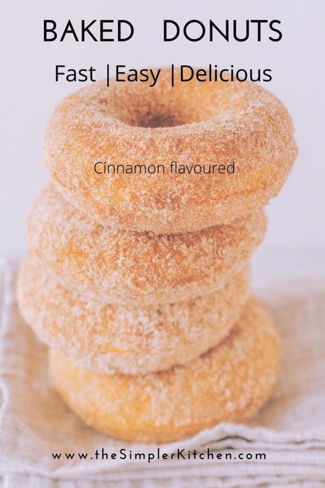 A stack of delicous homemade baked donuts. This recipe is quick and easy. You don't need a doughnut pan, a muffin pan will do. Rolled in cinnamon sugar for great flavour. Easy Cinnamon Donuts Recipe, Donut Cake Pan Recipe, Easy Cake Donuts Baked, Baked Cinnamon Donut Recipes, Simple Baked Donut Recipe, Homemade Cinnamon Donuts Recipe, Baked Donut Recipes With Donut Pan Easy, Baked Donut Recipes Easy, Quick Donut Recipe Baked