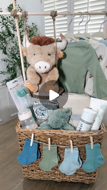 Kellie Atkinson on Instagram: "Baby shower gift basket 🧸🍼 🧺  Comment “Baby” for links sent to you inbox 💙🔗  #asmr #baby #babyshower #babyboy #babyshowergift #babyshowergiftideas #giftbasket" Baby Gift Basket With Hanging Clothes, Baby Basket With Hanging Clothes, Baby Shower Gift Closet Basket, Boho Baby Shower Basket, Baby Shower Crate Gift Basket Boy, Baby Shower Gifts Boy Basket, How To Wrap A Car Seat Gift, Baby Shower Baskets Boy, Baby Book Gift Basket