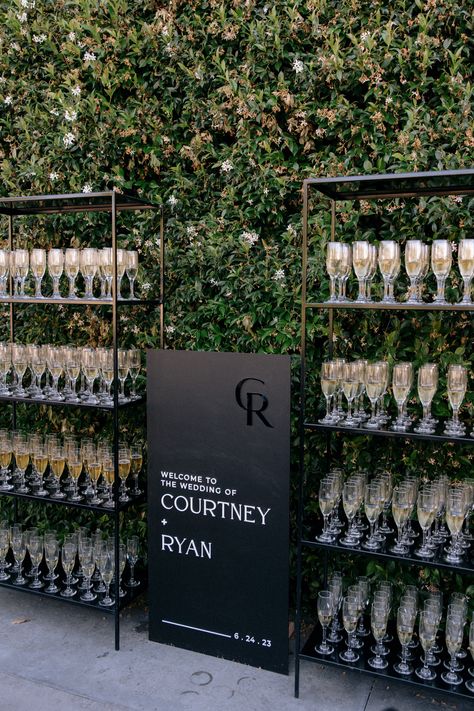 Wedding Cocktail Hour Food Display, Black And White Themed Wedding Reception, Dark Romantic Wedding Seating Chart, Black And White Champagne Wall, Wedding Champagne And Black, Champagne Shelves Wedding, Champagne Wedding Seating Chart, Wedding White And Black Theme, Black Tie Champagne Wedding