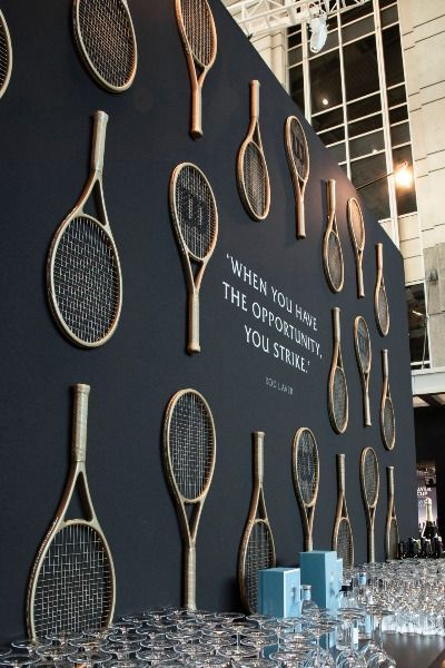 Tennis rackets adorn this custom bar | Luxury wedding, luxury event planner, event planner, event design, wedding inspo, wedding inspiration, event inspiration, chicago wedding, wedding details, wedding tablescape, modern wedding, wedding reception decor, floral design, wedding decor, chicago wedding venue, outdoor wedding reception, suprise birthday party ideas, birthday party decor, event decor, outdoor event reception, classic wedding decor, 2022 wedding trends, wedding tablescapes Event Decor Outdoor, Classic Wedding Decor, 2022 Wedding Trends, Bar Luxury, Photowall Ideas, Suprise Birthday, Floral Design Wedding, Tennis Party, Tennis Event