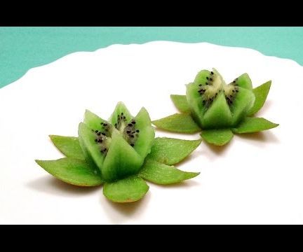 How to Make a Lotus Flower With a Kiwi in 1 Minute: In this video, I show you how to make a lotus flower with a kiwi. You can use the lotus flower as a garnish in a plate. Important notes: It's important to wash (with a soap for fruits and vegetables) and brush the kiwi, and then rinse under cold r... Fruit Party Decorations, Food Garnish, Deco Fruit, Fruit Garnish, Fruits Decoration, Fruit Ideas, Decorações Com Comidas, Fruit And Vegetable Carving, Creative Food Art