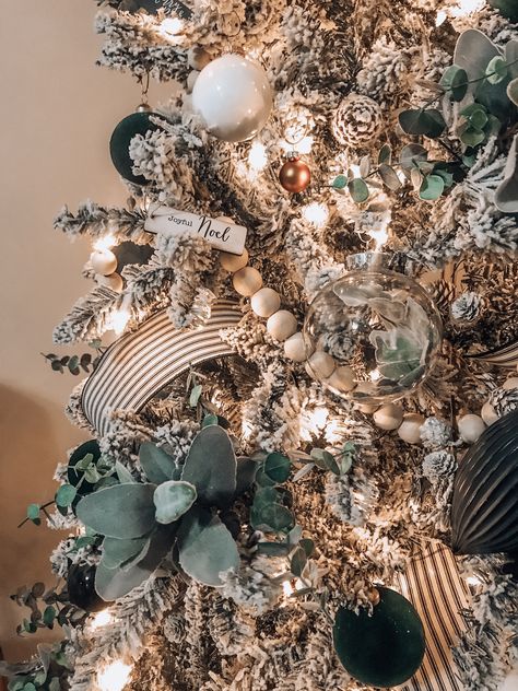 Boho Farm 2019 Christmas tree  #boho #bohemian #farmstyle #style #farm #christmas #tree #home #decor #green #plants #wood #beads #wicker #ornaments #flower #diy Tan And Green Christmas Tree, Cool Christmas Photo Ideas, Flocked Christmas Tree With Green Decor, Christmas Tree Styles 2023, Wood Beads On Christmas Tree, Sage Green And Black Christmas Tree, Glass Dome Decor Ideas Living Room, Boho Rustic Christmas Decor, Rustic Green Christmas Decor