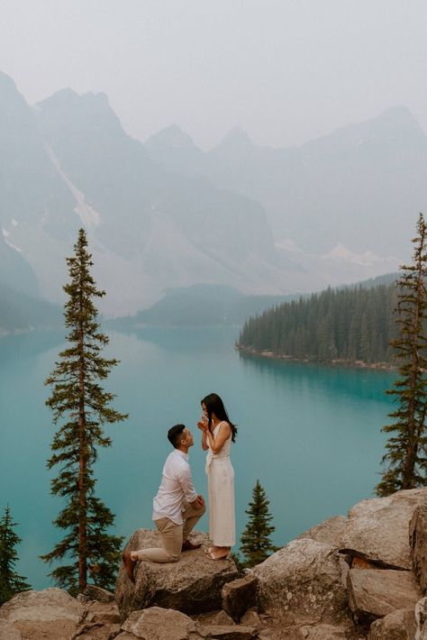 She said yes! Romantic proposal in Banff at Moraine Lake with a beautiful blue lake and mountains as the backdrop, in the Canadian Rockies. They had their dog be a part of the proposal too - engagement and proposal photos by Havilah Heger Wedding Proposal Ideas Engagement, Surprise Proposal Pictures, Lac Moraine, Cute Proposal Ideas, Proposal Pictures, Couple Engagement Pictures, Proposal Photos, Romantic Proposal, Engagement Locations