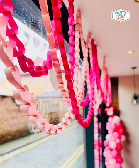 Valentines Paper Chain, Valentines Day Decorations Diy Kids, Paper Chain Window Display, Office Decor Valentines Day, Valentine's Day Office Decorations, Valentine's Window Display, Valentine’s Day Hallway Decor, Paper Chains Decoration, Valentines Ceiling Decorations