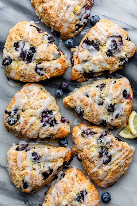 This is my go-to scone recipe packed with blueberries and topped with sweet lemon icing. These lemon blueberry scones are crumbly, yet moist and perfect for brunch, Easter, tea parties, bridal showers, Mother's Day, Father's Day, and so much more! Recipe on sallysbakingaddiction.com Blueberries Sauce, Easy Blueberry Scones, Berry Scones Recipe, Gluten Free Scone Recipe, Lemon Blueberry Scones, Blueberry Lemon Scones, Berry Scones, Blueberry Scones Recipe, Fruit Scones