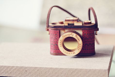 This wood & leather camera necklace made it on to my Christmas wish-list today... #photography Camera Jewelry, Camera Necklace, Vintage Film Camera, Dream Photography, Aztec Designs, Leather Skin, Vintage Film, Virtual Closet, Laura Lee