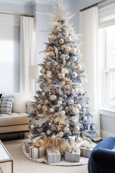 blue and silver Christmas decoration ideas including white christmas trees, blue ribbons, blue ornaments and more Natal, Christmas Blue And White Decorations, Gray Blue Christmas Tree, Blue And Neutral Christmas Tree, Christmas Tree Ideas Silver And Blue, Blue And Champagne Christmas Decor, Blue And White Christmas Party Theme, White Christmas Tree With Blue Ornaments, Light Blue And Gold Christmas Tree