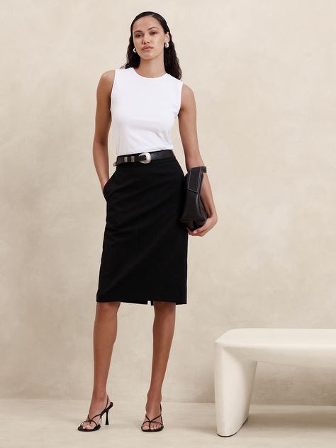 Indulgent and elegant, this expertly tailored pencil skirt elevates any wardrobe with a luxurious wool fabrication and a darted waist to accentuate in stunning proportions.  PENCIL SKIRT FIT: High rise, fitted from hip to hem.  RESPONSIBLE WOOL STANDARD CERTIFIED (Control Union Certifications CU 862581): This global standard protects the sheep that supply the wool for this sweater as well as the land they graze, working to make it better for the environment and the sheep.  Certified by NSF Certi Office Outfits Women Skirt, Banker Outfits, Black Pencil Skirt Outfit, Chic Business Attire, Business Casual Skirt, White Skirt Outfits, Work Skirt, Lawyer Fashion, Tailored Skirt