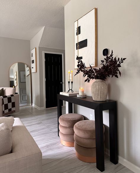 Looking for the finishing touch to bring your space together? Our console tables add beautiful details to complete your vision.⁠ .⁠ Our solid wood console tables have stunning, minimalist designs. They are the perfect staple for any room, hallway, or entryway, giving you a base to show off your style through decor. Click the link in our bio to check out all of our console table designs!⁠ .⁠ #plankandbeam #console #livingroomdecor #hallwaydecor #homedetails #quietluxury #minimalistaesthetic Dark Entryway Ideas Modern, Black Furniture Decor Ideas, Console Table For Living Room, Black Entry Way Table Decor Ideas, Black And Neutral Apartment Aesthetic, Small Entryway Ideas Narrow Hallways Entrance Home Decor, Black Console Table Hallway, Black Entryway Table Decor, Tv Table Decor