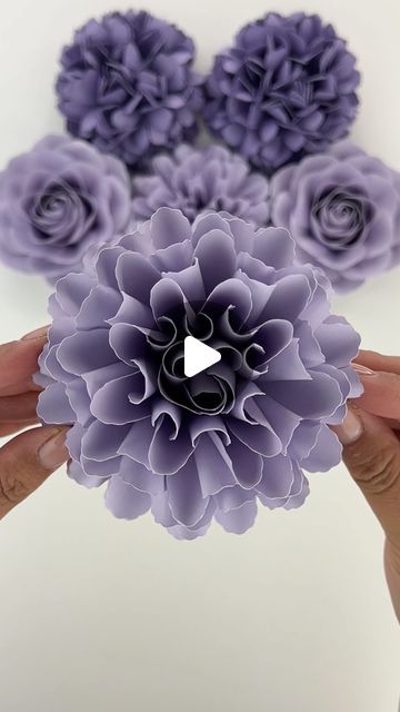 Hey, I’m Judy 👋🏻 Paper Flower Art + Tutorials on Instagram: "Snow storm today! Hope you’re keeping warm and cozy, wherever you are ❤️ Happy Friday! My Mini Marigold template is available in my Etsy shop, link in bio! #paperflowers #purpleaesthetic #cricut #cricutmade #teamcricut #cricutcrafts #makeitwithmichaels #makersgonnamake #maker #etsyhandmade #paperart #paperaddict #diy #crafts #craftersgonnacraft #paperartist #paperflorist #paperflorals #etsyfinds #paperroses #handmade #handmadewithlove #imadethis #paperflowerbackdrop #diypaperflowers #roses #weddingflowers #weddingbouquet" Origami Paper Flowers Tutorial, Marigold Template, Fleetwood Mac Everywhere, Folded Paper Flowers, Paper Rose Template, Paper Flower Art, Paper Flower Crafts, How To Make Paper Flowers, Paper Flower Backdrop