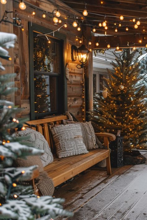 Dreaming of a festive Farmhouse Christmas porch? Dive into a collection of 50+ modern decor ideas to bring your vision to life. Explore rustic garlands, charming decorations, and inviting front signs for a cozy and cheerful holiday season! Natal, Cabin Porch Christmas Decor, Christmas In The Cabin, Christmas Dock Decorations, Farmhouse Outdoor Christmas Decorations, Christmas Decor Front Of House, Farmhouse Christmas Aesthetic, Christmas Front Porch Small, Rustic Farmhouse Porch Ideas