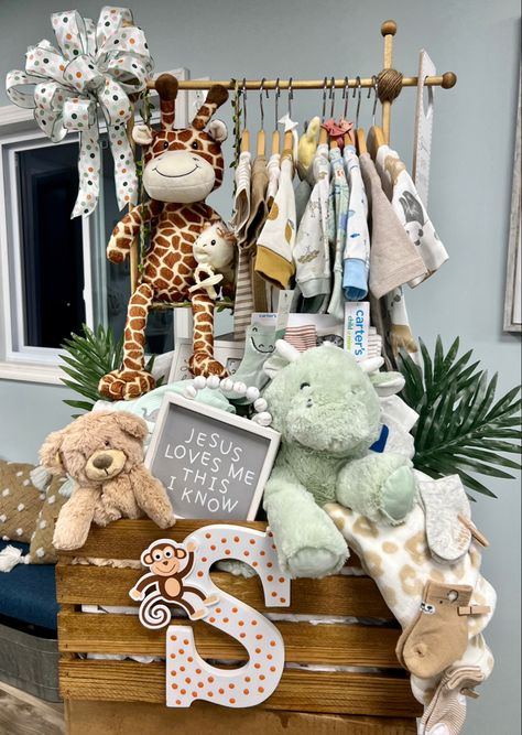 This was a fun, beautiful creation made I made for a baby shower gift. I added a jungle swing for the giraffe, Inital “S” and added dots and a monkey and of course stuffed the crate with lots of baby stuff! Personalized Baby Shower Gifts For Boys, Baby Shower Gifts For Boys Basket, Cute Baby Gifts For Boys, Gender Reveal Closet Diy, Safari Baby Basket, Baby Shower Basket Gifts, Cute Baby Boy Shower Gifts, Baby Shower Baskets Boy, Baby Clothes Basket Gift