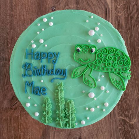 This gluten-free birthday cake is decorated with a sweet little sea turtle swimming around in an ocean of edible pearl bubbles. Turtle Decorated Cake, Swim Birthday Cake, Two Year Old Turtle Birthday, Turtle Themed Cake, Turtle Cake Birthday, Sea Turtle Themed Birthday Party, Sea Creature Birthday Cake, Franklin The Turtle Birthday, Ocean Cakes For Kids