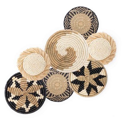 Turn a bare wall into a dramatic focal point with these beautiful woven baskets. Their rich textures, earthy colours, and unique handcrafted details add homey warmth to any space. | Bungalow Rose 7 Piece Boho Baskets Wall Decor Set black/Brown 14.0 x 14.0 x 2.0 in | Home Decor | C010523994 | Wayfair Canada Basket Wall Decor Boho, Boho Basket Wall Decor, Boho Wall Basket Decor, Woven Basket Wall Decor, Boho Baskets, Quirky Accessories, Boho Basket Wall, Woven Basket Wall, Expensive Artwork