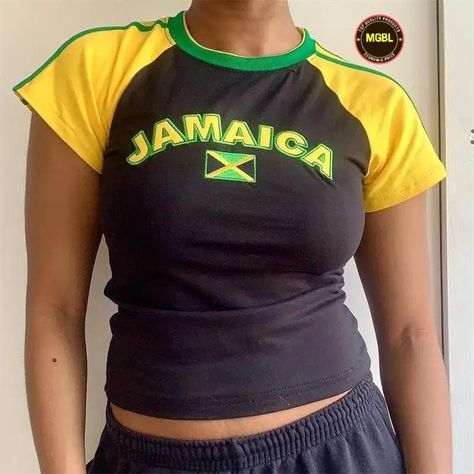 Introducing our Angel Baby Y2K Jamaica Crop Top Baby Tee, a vibrant and stylish piece inspired by the energetic spirit of Jamaica and the iconic fashion trends of the 90s and 2000s. This crop top baby tee combines elements of soccer jersey design with a nod to Jamaican culture, making it a standout addition to your wardrobe. Crafted with attention to detail, our crop top baby tee features a classic silhouette with a cropped length, perfect for pairing with high-waisted bottoms. The soccer jersey-inspired design adds a sporty and nostalgic touch, while the Jamaican flag colors and imagery pay homage to the rich cultural heritage of Jamaica. Whether you're a fan of retro fashion or simply love to express your love for Jamaican culture, our Angel Baby Y2K Jamaica Crop Top Baby Tee is sure to Jamaica Jersey, Vintage Jamaica, Crop Top Aesthetic, Shirt Y2k, Baby Crop Top, Aesthetic Retro, Y2k Clothes, Top Streetwear, Vintage Short