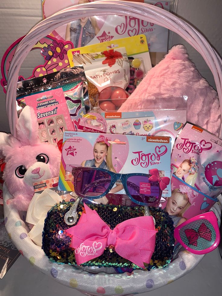 a pink basket filled with lots of toys