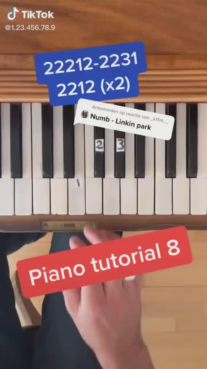 This may contain: someone is playing the piano on their keyboard and has two stickers attached to it