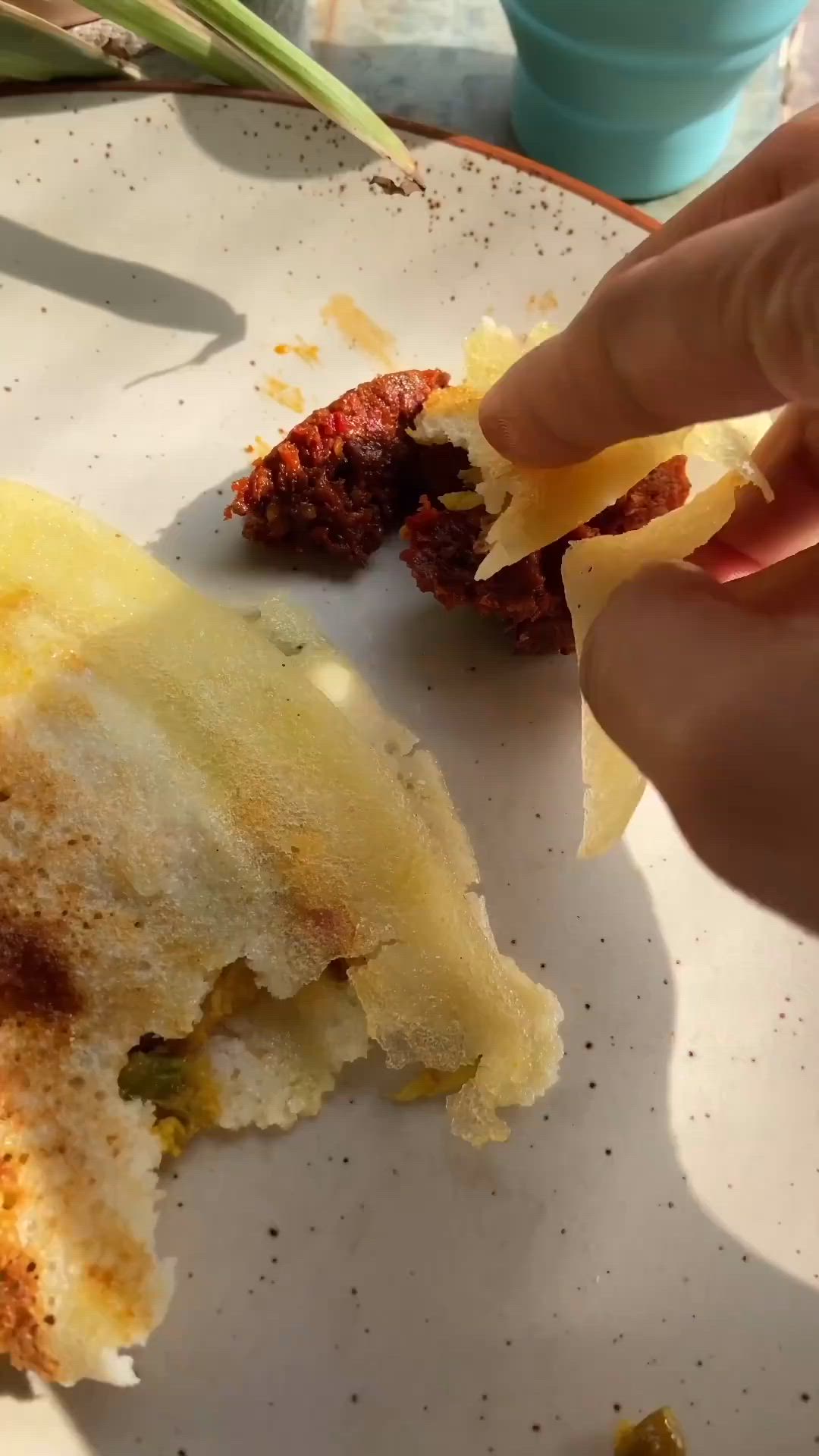 This may contain: a half eaten piece of food sitting on top of a white plate