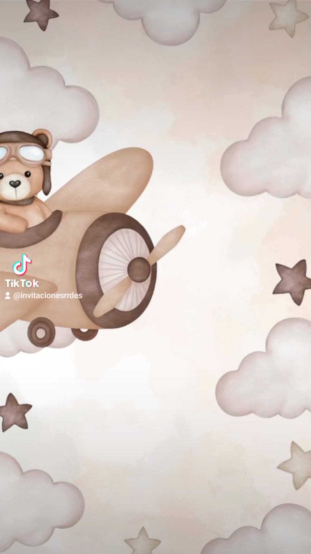 This may contain: a teddy bear flying in an airplane with stars on the wall and clouds behind it