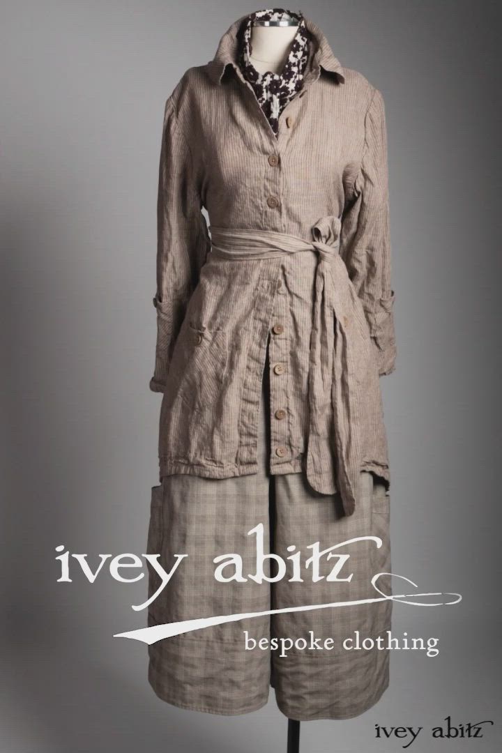 This may contain: an image of a woman's dress on display with the words ivvey abitiz