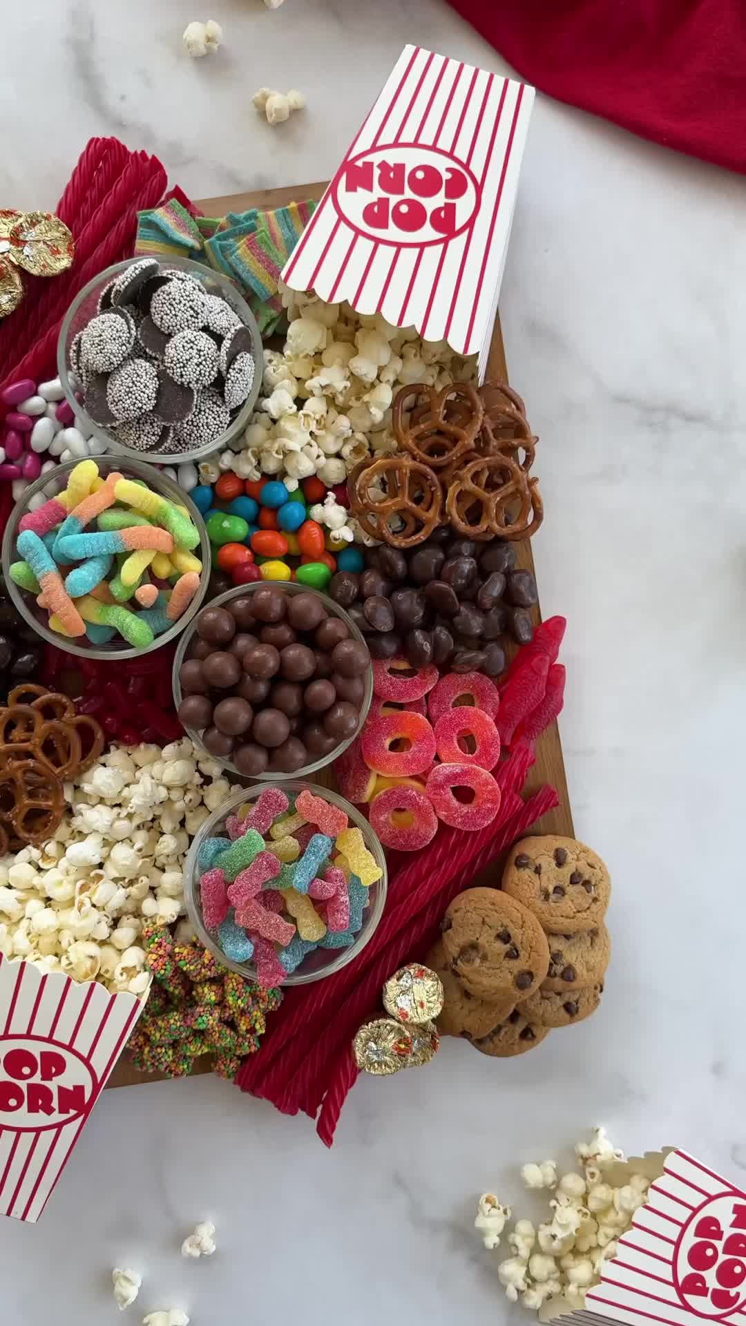 This may contain: a star shaped tray filled with lots of candy and cookies on top of a table