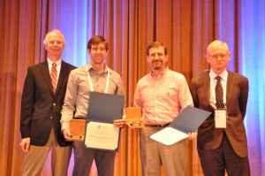 From left to right: Bill Cook, MOS President; Stephen Becker; Michael Grant; Robert Bixby, co-founder of Gurobi Optimization, nomination committee member.