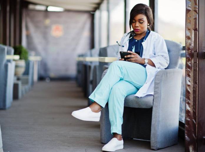 Healthcare worker reading an ebook