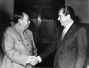 Black & White picture of President Nixon of the USA shaking hands with Chairman Mao of China.