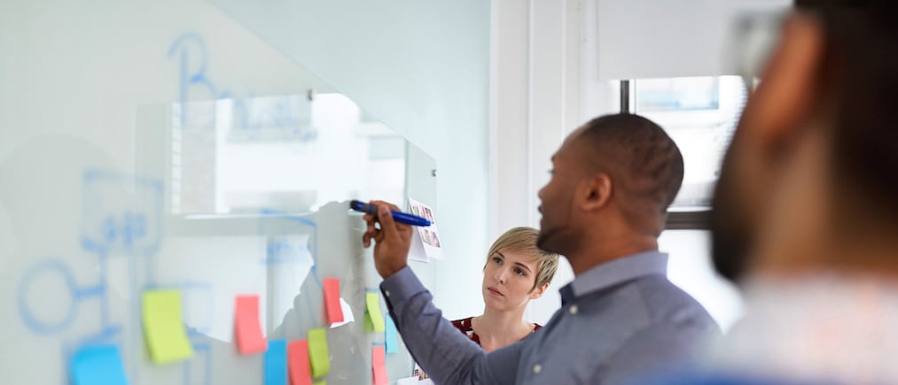 Multi-ethnic group of hipster trendy businessmen and businesswomen people during a brainstorm session for their small company