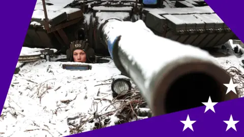 A Ukrainian soldier looks out from a tank near Bakhmut, eastern Ukraine