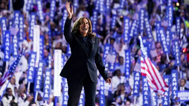 Kamala Harris waves to the crowd after speaking on the final day of the DNC