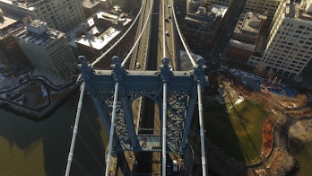 Aerial View Of Manhattan Bridge With Buildings On The Sides Shutterstock 591394799