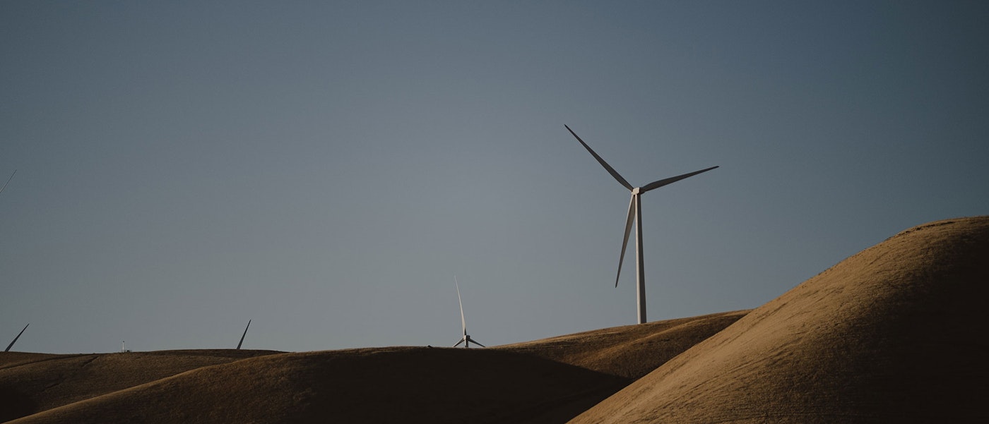 Global Energy Transitions Stocktake Cover Image A Field Of Wind Turbines