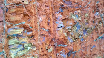 the photo depicts a not focused on the surface of nickel ore saprolite in open pit mines