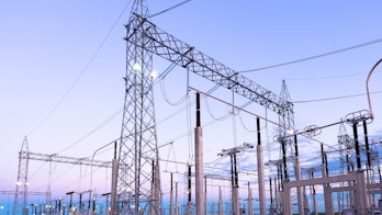 Cover of Electricity Market Report 2023 - A photograph of a power plant at sunrise