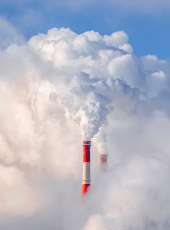 Photo Depicting Smoke From Chimneys Against Blue Sky Background Shutterstock 1662983170