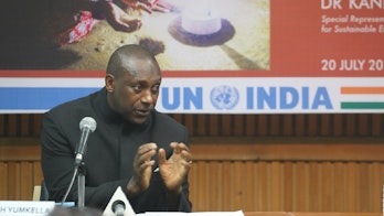 Dr Kandeh Yumkella holding speach