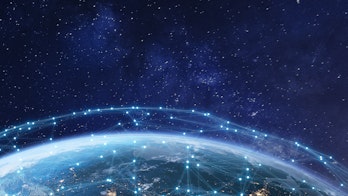 Photo depicts Telecommunications network over North America from space at night with city lights in the United States, Canada and Mexico, satellite orbiting Planet Earth for the Internet of Things IoT and blockchain technology