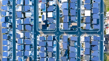 New aerial view of residential area with solar panels