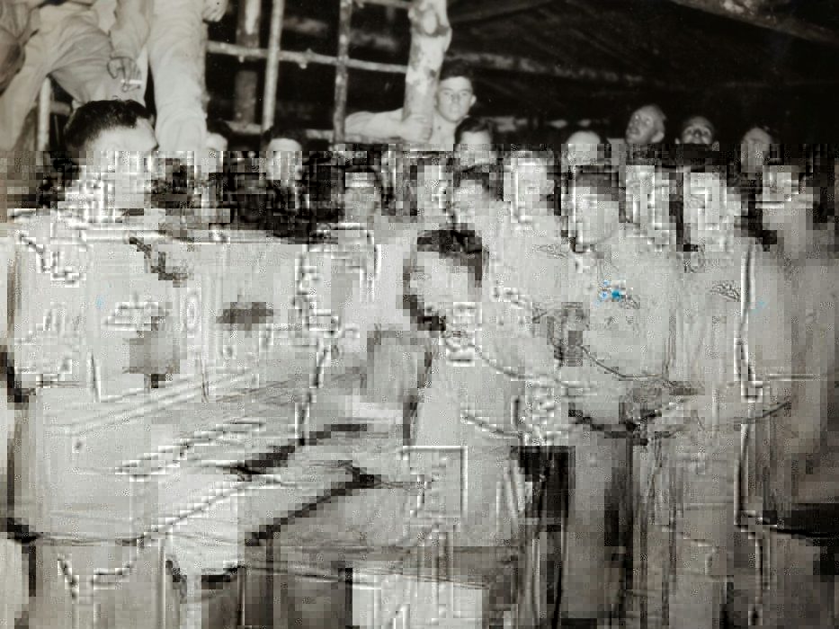 grayscale photo of 4 men standing beside piano