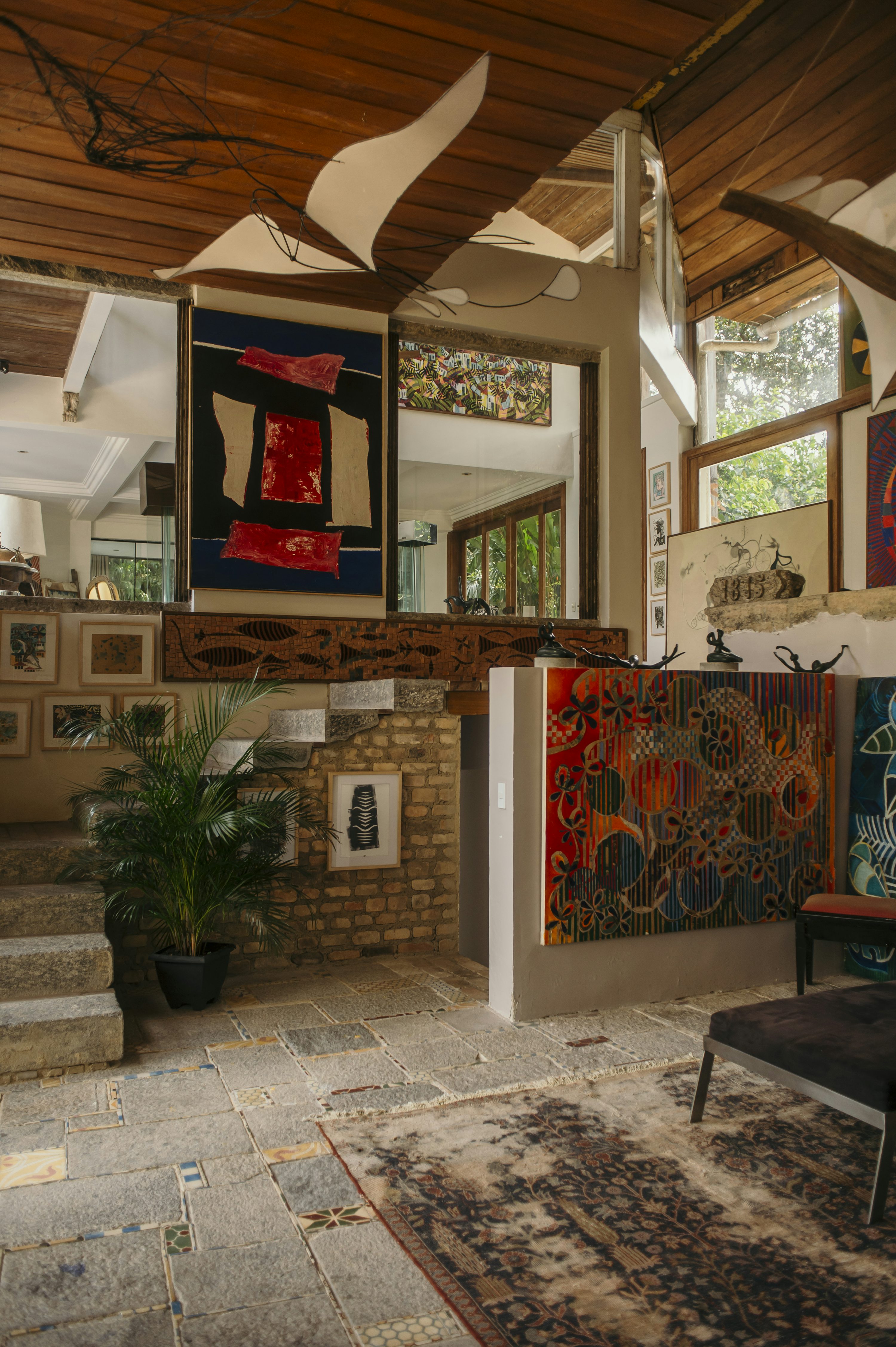 A living room filled with furniture and paintings