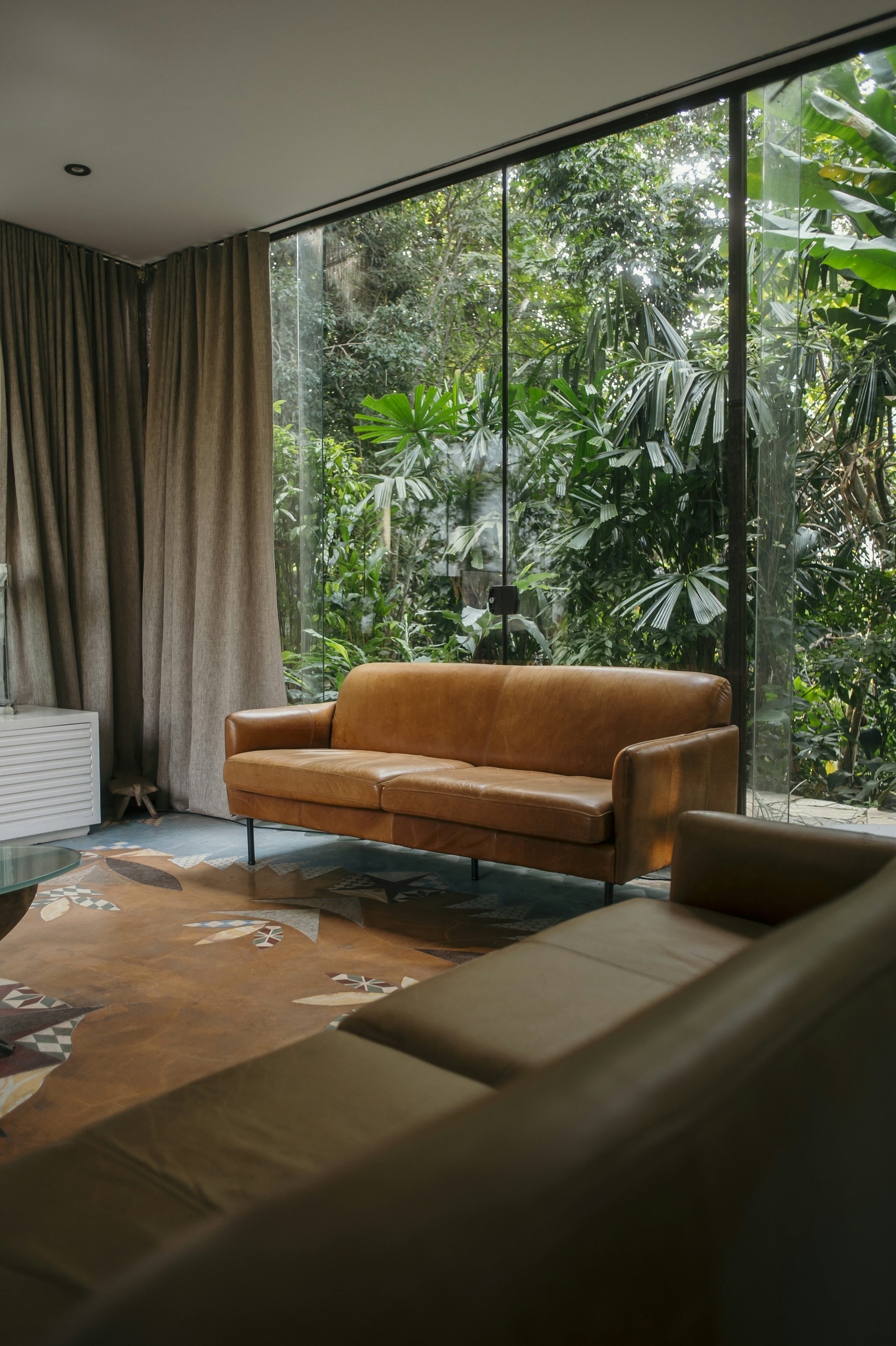 A living room filled with furniture and a large window