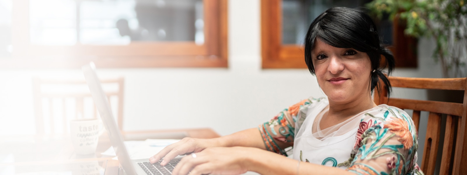 A woman using laptop working from home